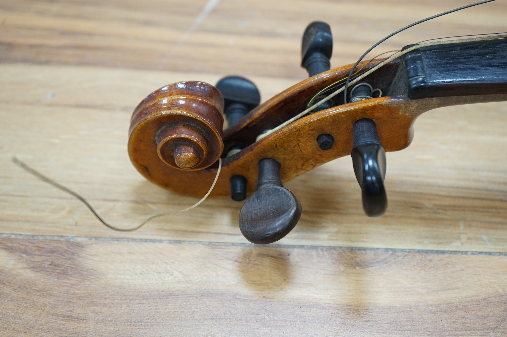 A cased full length violin, circa 1900, with bow, bears Stradivarius label to the interior. CITES Submission reference WVME8714